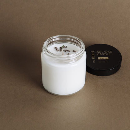 Nelken & Orangen-Minikerze im Glaswindlicht